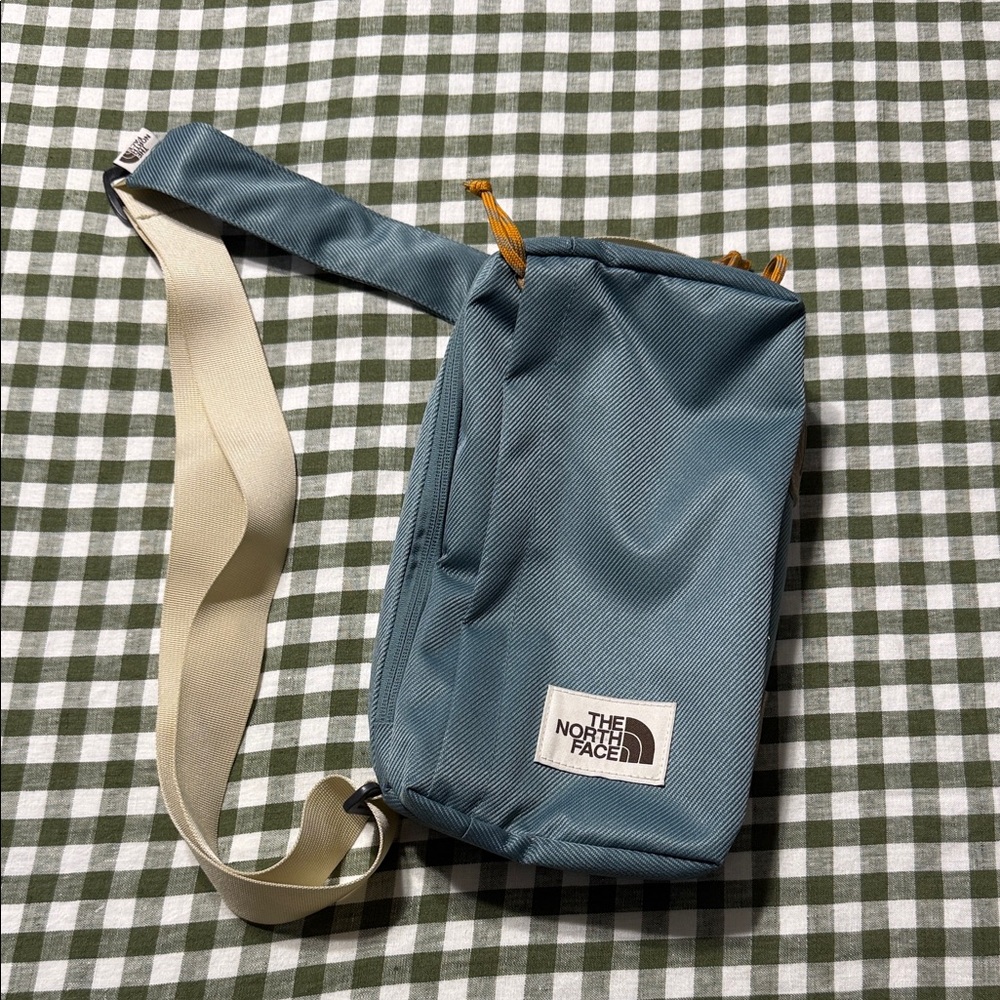 The North Face Teal Belt Bag with Cream Strap